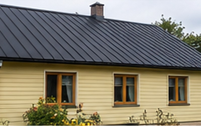 Roof covering replacement project in Ādaži - finished result with new metal covering